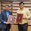 L-to-R-Mr.-Anand-Mimani-CEO-EV-New-Energy-Business-Blue-Energy-Motors-and-Mayank-Tyagi-IDAS-Director-Ministry-of-Road-Transport-Highways-rrrrrrrr-1